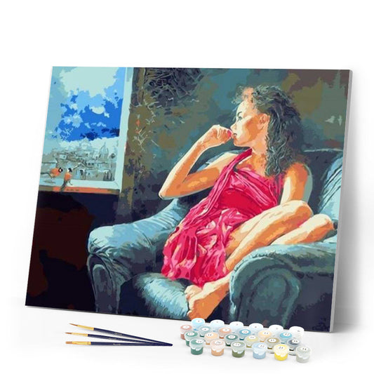 Pensive woman near the window